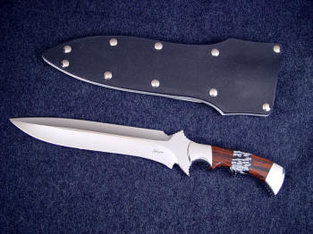 "Kadi" Obverse side view: 440c high chromium stainless steel double hollow ground blade, 304 stainless steel bolsters, Mahogany Obsidian and Snowflake Obsidian gemstone handle, aluminum, kydex, nickel plated steel sheath "Kadi" Obverse side view: 440c high chromium stainless steel double hollow ground blade, 304 stainless steel bolsters, Mahogany Obsidian and Snowflake Obsidian gemstone handle, aluminum, kydex, nickel plated steel sheath