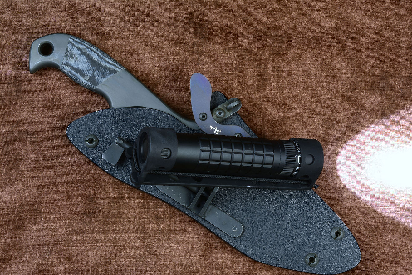 HULA on tactical counterterrorism combat knife, with high intensity aimable articulating flashlight and holder