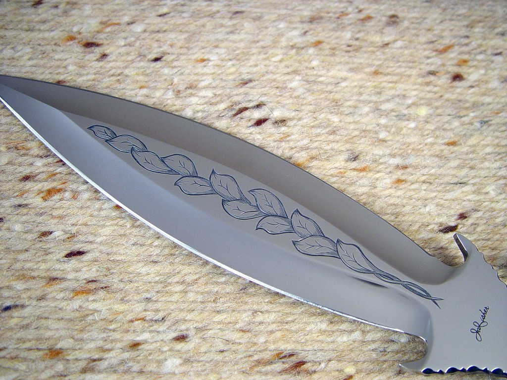 "Amethystine" obverse side view: hand-engraved 440C high chromium stainless steel blade, 304 stainless steel guard and pommel, sterling silver wire wrap and ferrules, Sodalite Gemstone handle, blue Stingray skin inlaid in hand-carved leather sheath