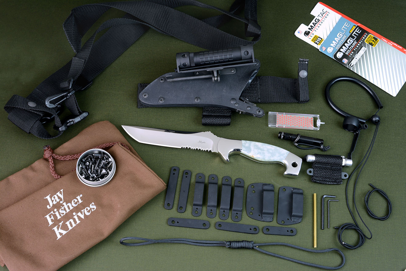 "Arctica" with accessories in locking kydex waterproof sheath, ultimate belt loop extender with sharpener, LIMA, solitaire LED lamp, Magnesium firestarter, alternate belt loop and strap mounts, extra hardware and tools