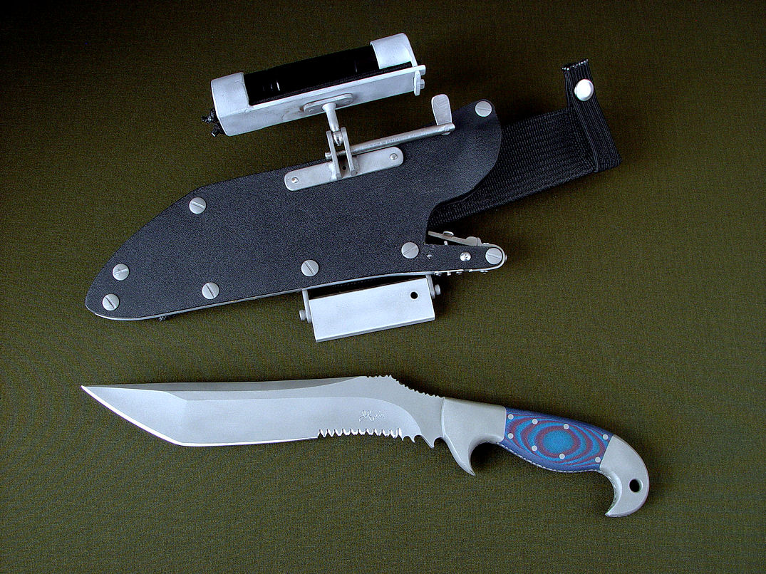 "Arcturus" obverse side view in ATS-34 high molybdenum stainless steel blade, 304 stainless steel bolsters, red/blue G10 fiberglass/epoxy composite handle, locking kydex, aluminum, stainless steel sheath with ultimate extender and HULA accessories