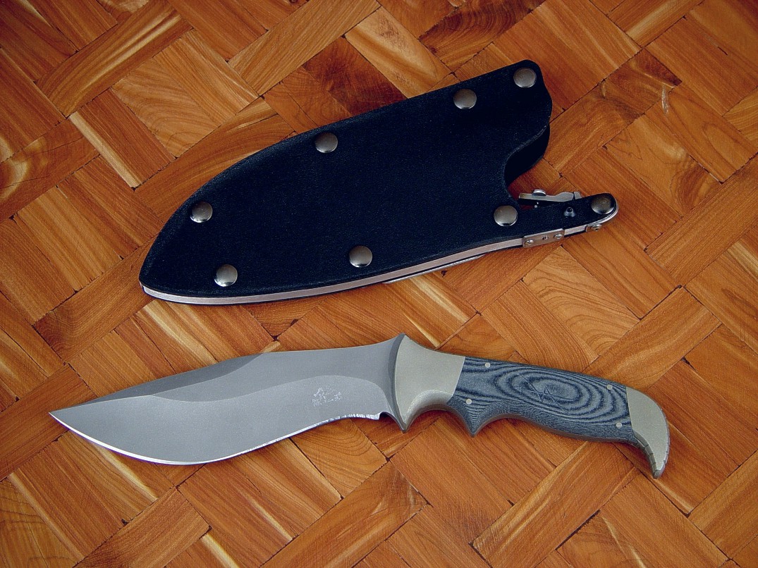"Hooded Warrior" sniper's custom combat knife, obverse side view in ATS-34 high molybdenum stainless steel blade, nickel silver bolsters, canvas micarta phenolic handle, locking kydex, aluminum, stainless steel sheath