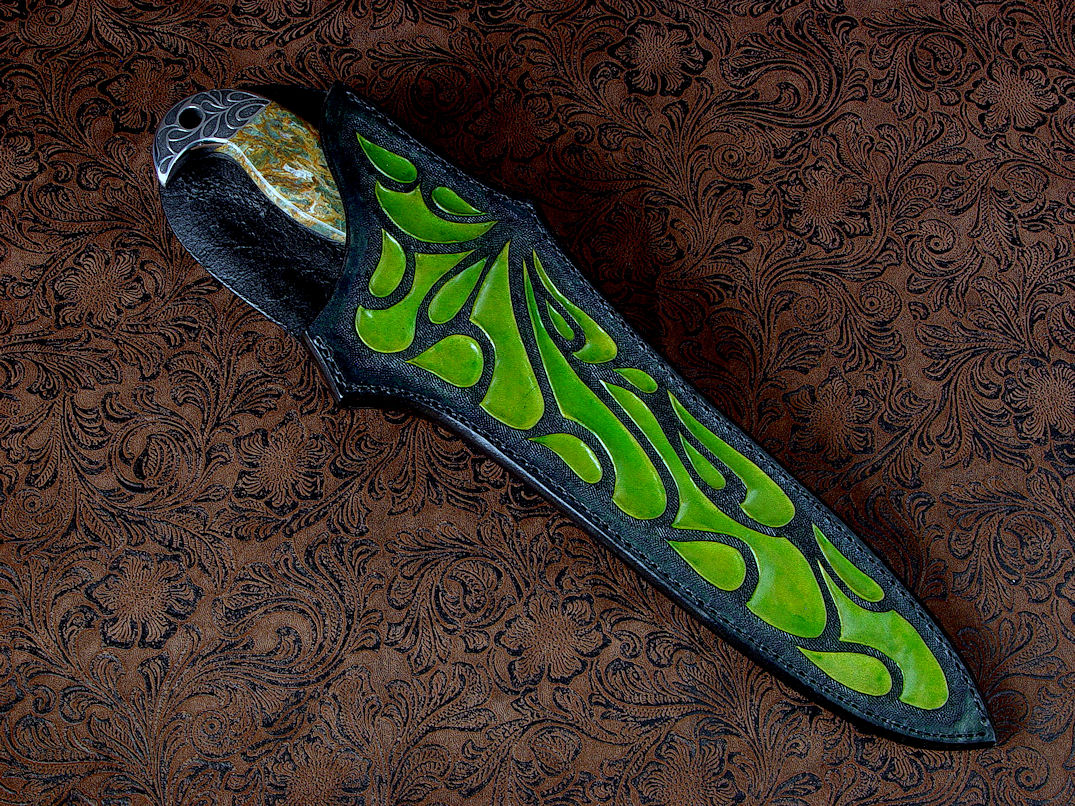 "Macha Navigator EL" sheathed view in 440C high chromium stainless steel blade, hand-engraved 304 stainless steel bolsters, Plasma Agate gemsone handle, hand-carved, hand-dyed leather sheath