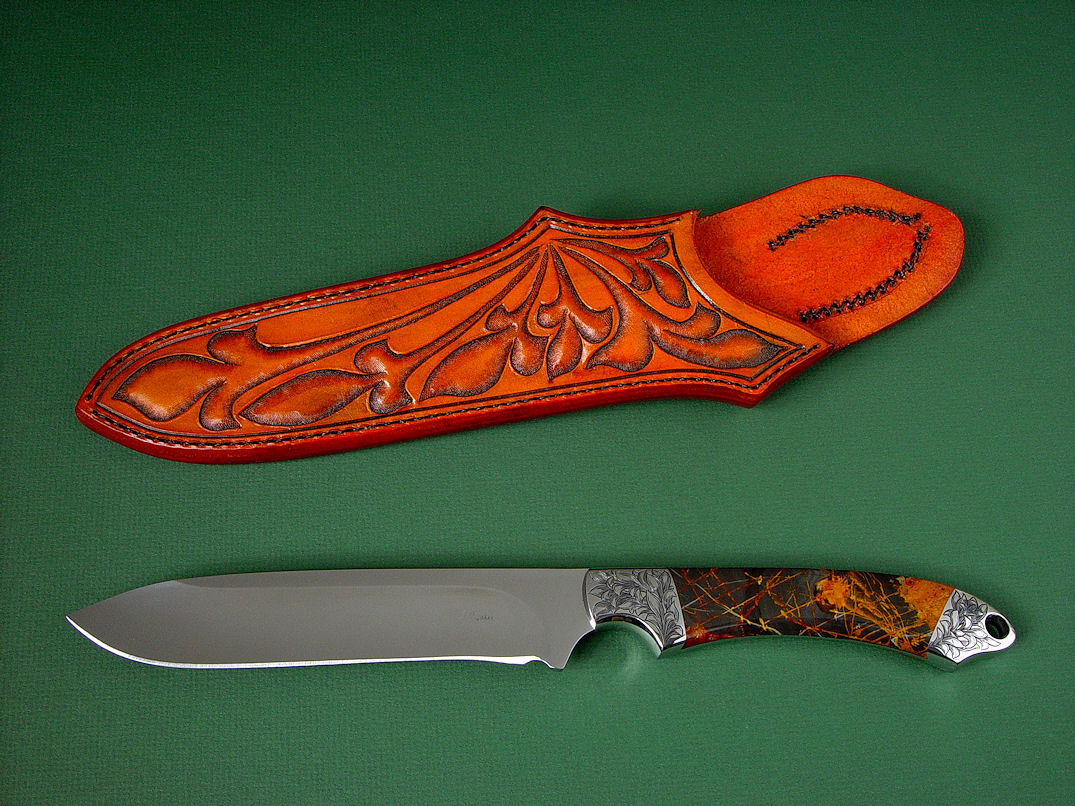 "Magdalena Magnum" obverse side view in D2 extremely high carbon die steel blade, hand-engraved 304 stainless steel bolsters, Pilbara Picasso Jasper gemstone handle, hand-carved, hand-tooled leather sheat