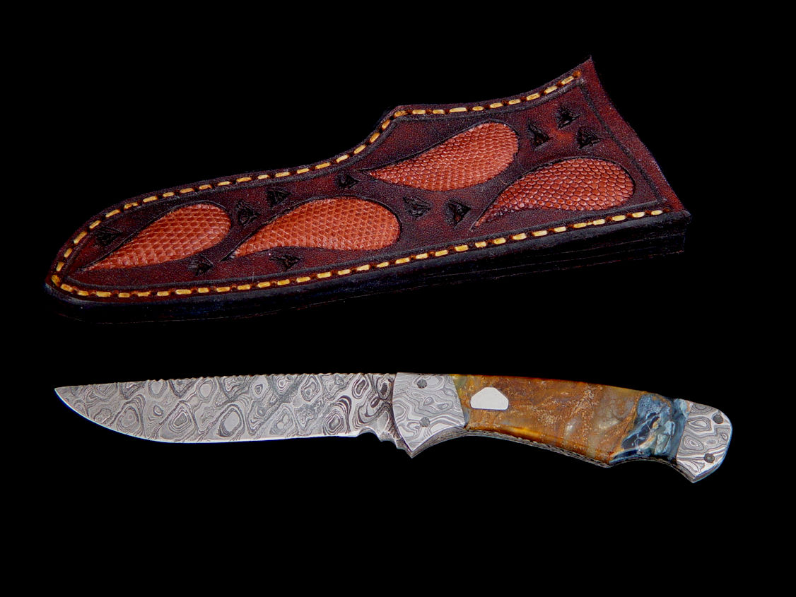 "Mizar" obverse side in pattern welded O1 and A36 steel blade and bolsters, Pietersite agate gemstone handle, hand-carved leather sheath inlaid with tegu lizard skin