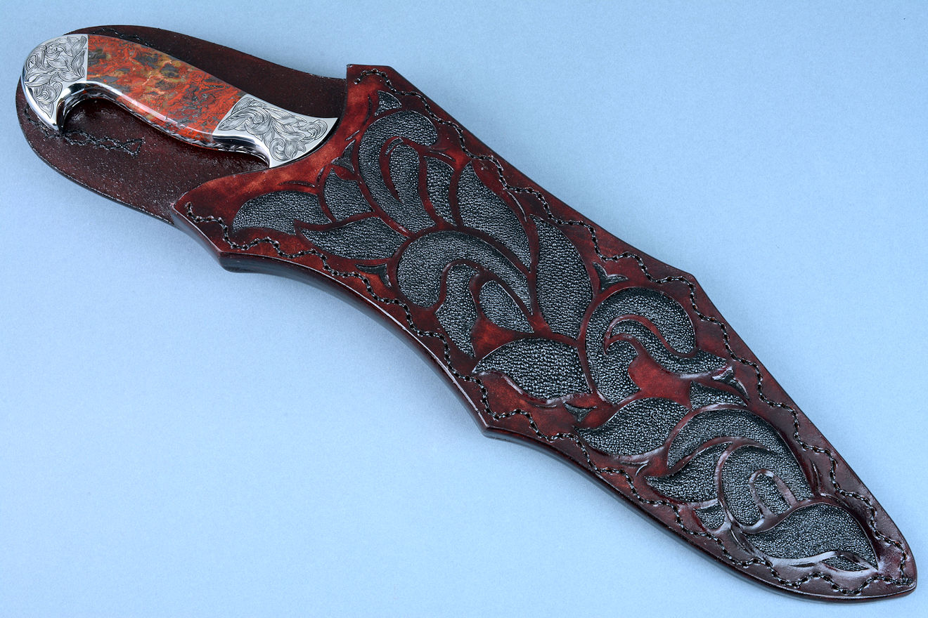 "Pallene" obverse side view in CPM154CM high molybdenum powder metal technology tool steel blade, hand engraved, with hand-engraved 304 stainless steel bolsters, Brecciated Jasper gemstone handle, and a sheath of hand-carved leather inlaid with rayskin