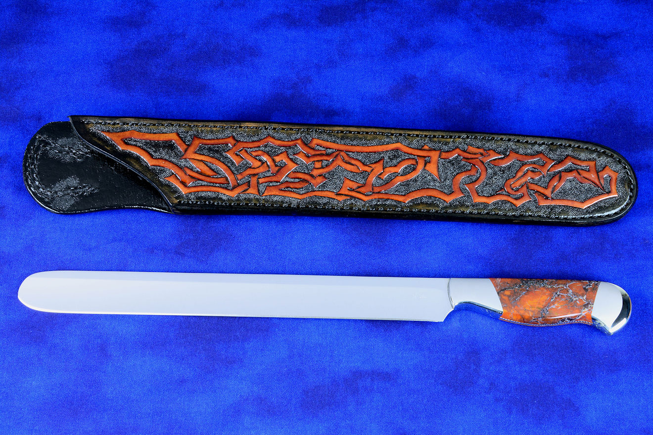 "Rebanador" Fine Custom Handmade knife, obverse side view in t3 cryogenically treated 440C high chromium stainless steel blade, 304 austenitic stainless steel bolsters, Stone Canyon Jasper gemstone handle, hand-carved, hand-dyed leather sheath
