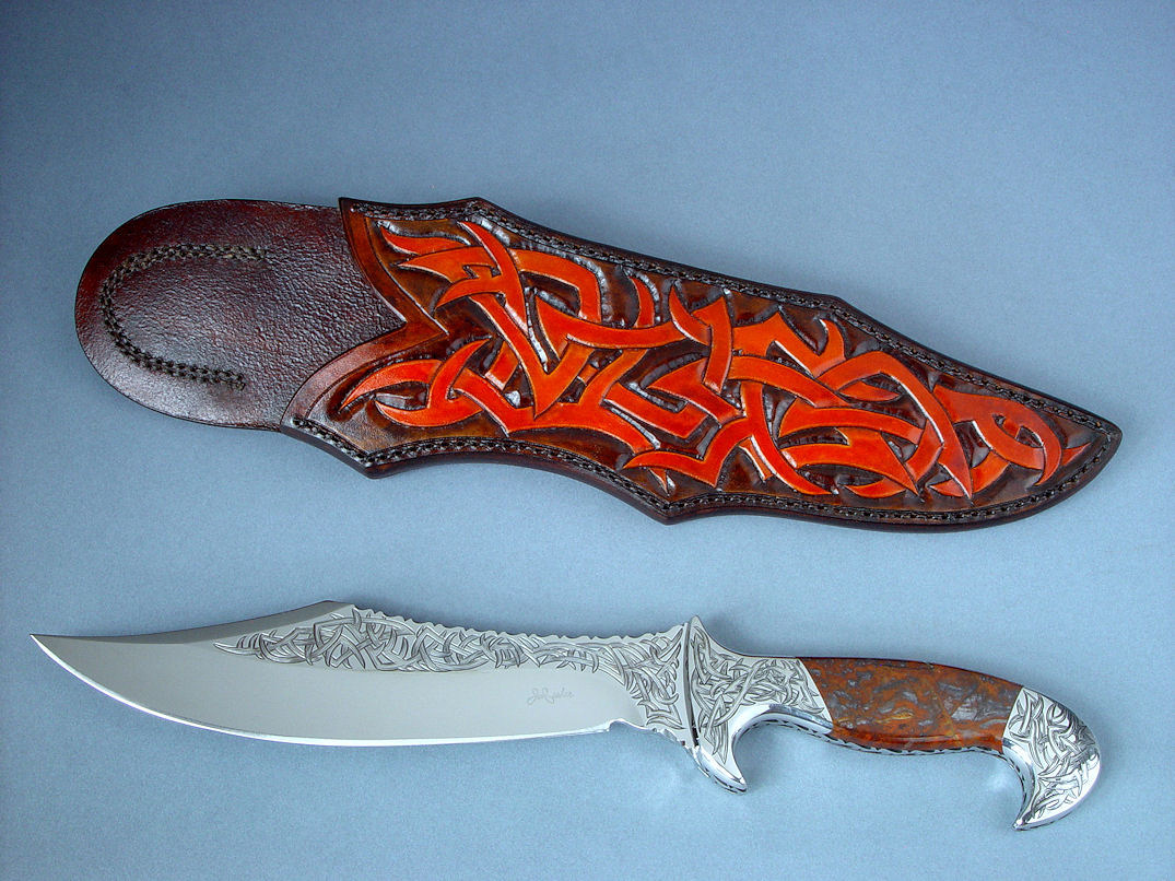 "Tribal" (Helhor pattern) in hand-engraved 440c high chromium stainless steel blade, 304 stainless hand-engraved bolsters, Pilbara Picasso Jasper gemstone handle, hand-carved and hand-dyed leather shoulder sheath