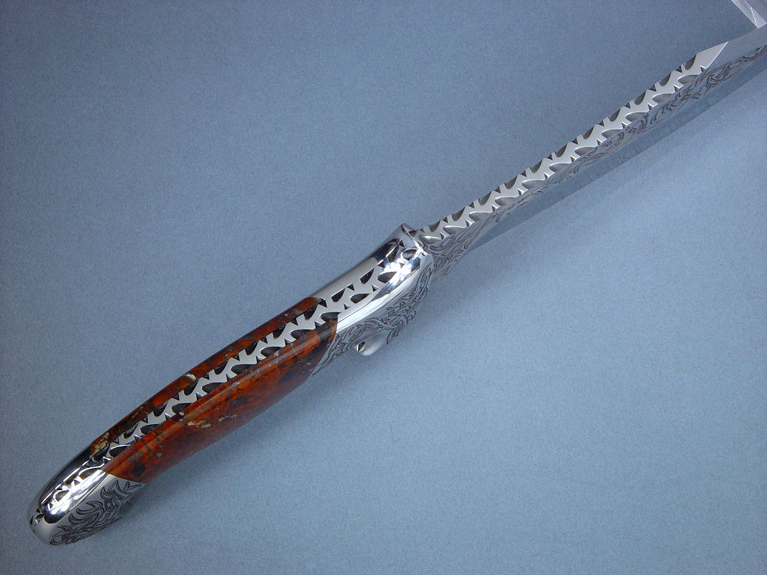 "Tribal" (Helhor pattern) spine edgework, filework detail. Filework is full and bold around tapered tang of handle