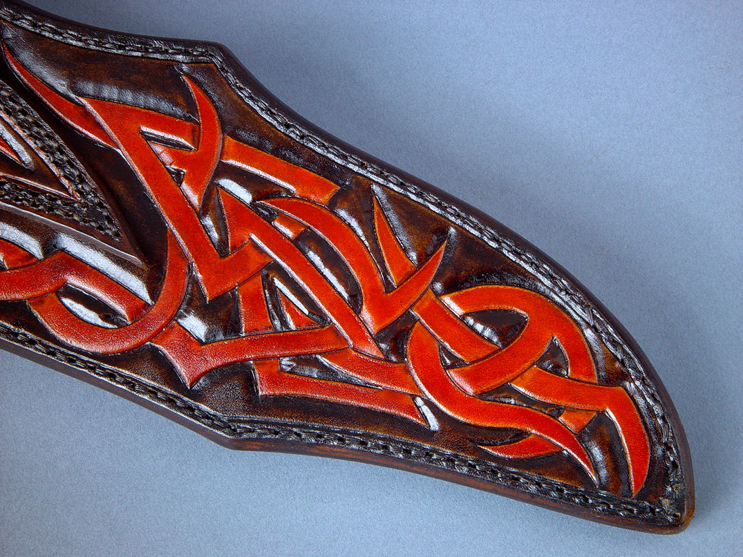 "Tribal" (Helhor pattern) sheath, back view. Sheath is entirely hand-carved and meticulously hand-dyed in leather shoulder, front and back, and hand-stitched in black nylon