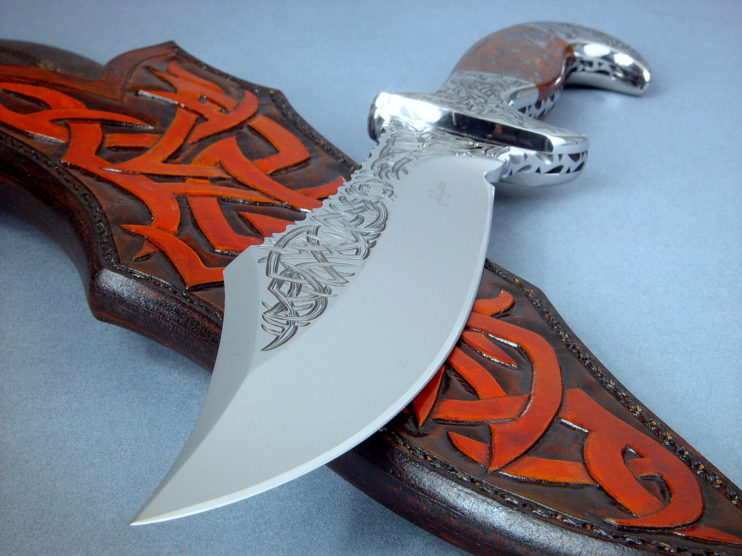"Tribal" (Helhor pattern) point detail. Knife is deeply hollow ground with a clip point swage and razor keen cutting edge.