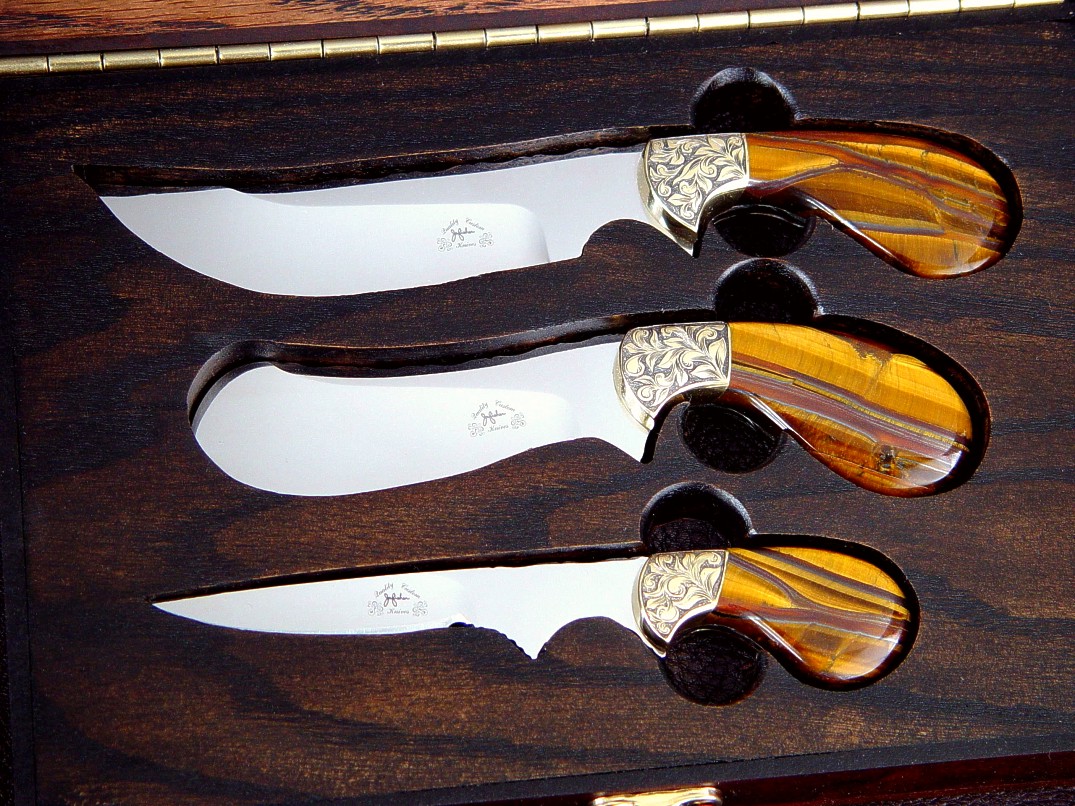 "Trophy Game Set" obverse side view in D2 extremely high carbon die steel blades, hand-engraved brass bolsters, Tiger Eye Gemstone handles: field dressing, skinning, caping knives