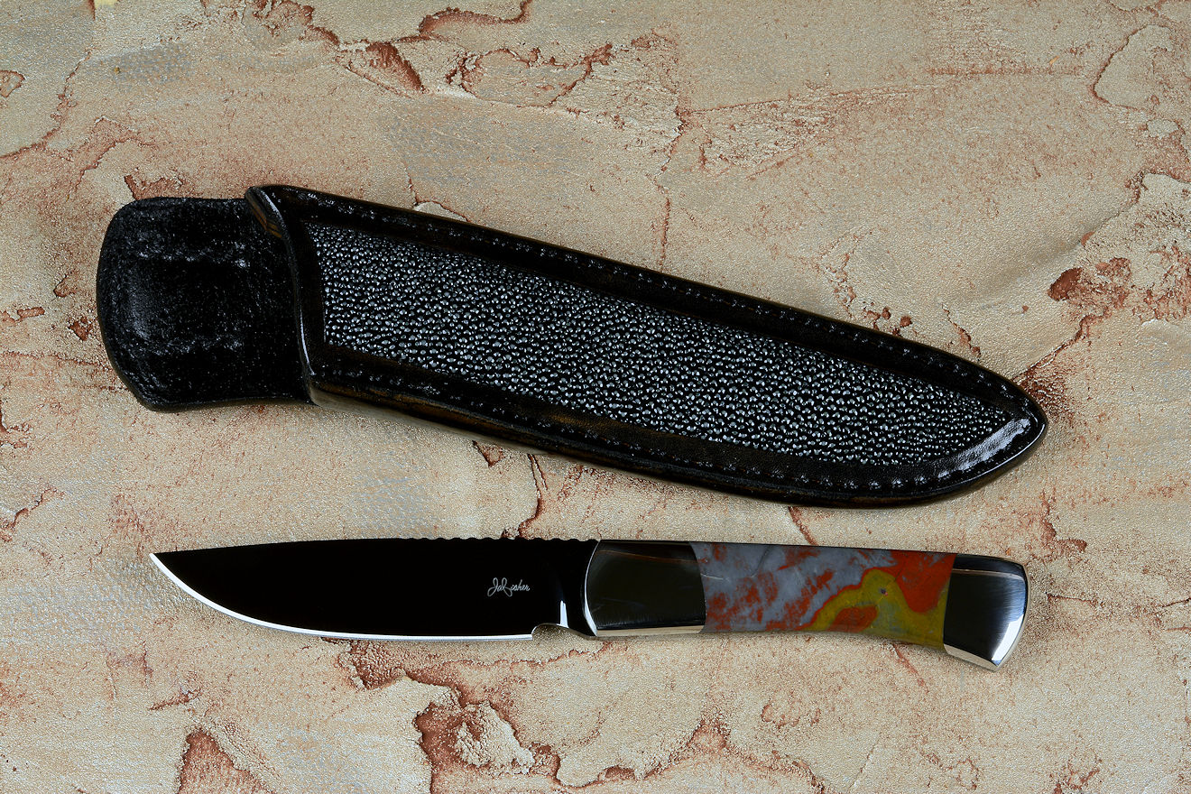"Zeta", obverse side view, in cryogenically treated O-1 high carbon tungsten vanadium tool steel blade, 304 stainless steel bolsters, Sunset Jasper gemstone handle, hand-carved leather sheath inlaid with black-gray rayskin