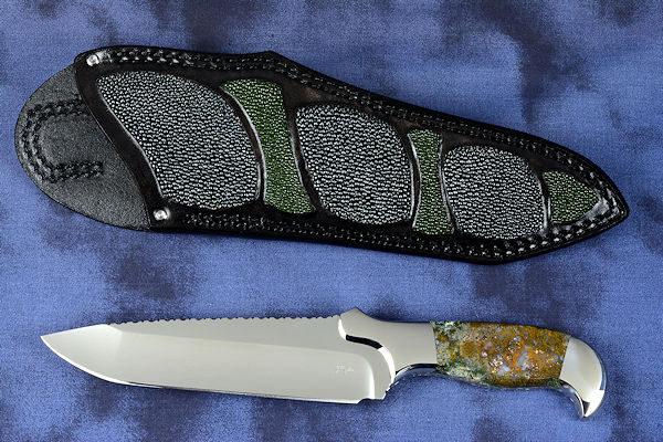 "Axia EL" fine handmade knife obverse side view  in T3 deep cryogenically treated CPM 154CM high mollybdenum powder metal technology martensitic stainless steel blade, 304 stainless steel bolsters, Linda Marie Moss Agate gemstone handle, hand-carved leather shoulder inlaid with green, black ray skin