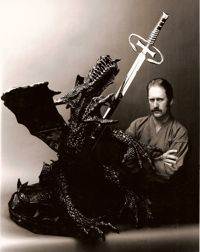 Jay with Dragonslayer, a 400 pound bronze, steel, and gemstone sword sculpture, all handmade