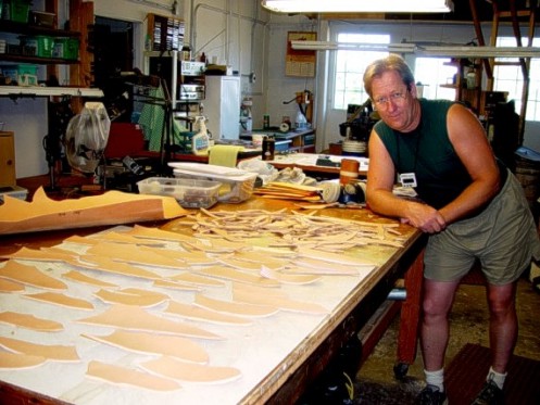 Jay with leather work: many knife sheaths under construction