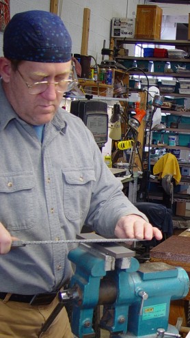 Sharpening the other blade side. Note the low angle of the blade on the stone