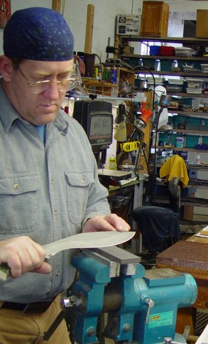 Here I am sharpeing a khukri blade on a hard ceramic stone