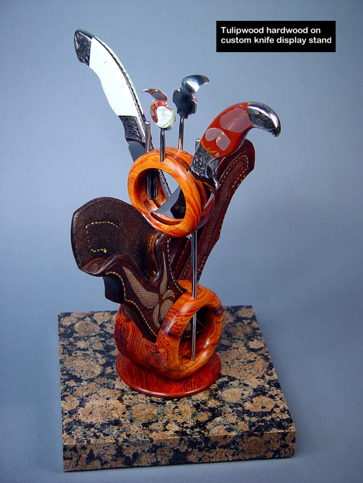 Tulipwood is used in the sculputural rings of this custom knife display stand