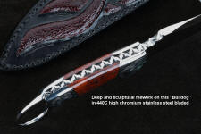 "Bulldog" spine view in 440C high chromium stainless steel blade, hand-engraved 304 stainless steel bolsters, Fossilized Stromatolite Algae gemstone handle, hand-carved leather sheath inlaid with burgundy ostrich leg skin