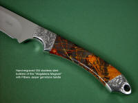 "Magdalena Magnum" obverse side view in D2 extremely high carbon die steel blade, hand-engraved 304 stainless steel bolsters, Pilbara Picasso Jasper gemstone handle, hand-carved, hand-tooled leather sheat