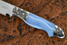 "Perseus" obverse side view in 440C high chromium martensitic stainless steel blade, hand-engraved 304 stainless steel bolsters, blue lace agate gemstone handle, hand-carved, hand-dyed leather sheath
