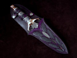 "Amethystine" dagger, sheathed view. Sheath has windows to blade, spiral retaining strap, all full inlays throughout