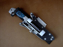 "Arctica" with HULA assembly folded in sheath front. The articulation of the HULA allows multiple wear and orientation options on the sheath body, in front, behind, and at the side of the sheath.