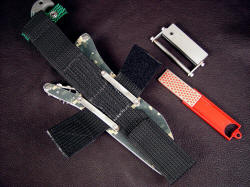 "Arcturus" with accessories. Sheath belt loop extender is multiple zigzag stitched in heavy nylon, tough and stout, accessories are sharpener and fire starter with safety guard