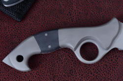 "Ari B'Lilah" reverse side handle view. Bolsters are T2 pure titanium for extreme light weight and corrosion resistance, handle scales are G10 epoxy-fiberglass composite. Large lanyard hole is chamfered, easy to thread and use. Rear talon at butt is tough and useful adjunct