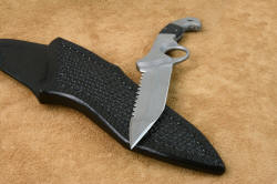 "Ari B' Lilah"  Counterterrorism Tactical Combat Knife, point, serration detail. This is a very hard, extremely sharp and aggressive blade with a substantial spine for supporting strength