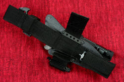 "Ari B'Lilah" professional counterterrorism knife, 2" hook and loop unhooked, showing flat mounting bars that secure the device to the sheath