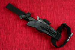 "Ari B'Lilah" professional counterterrorism knife, EXBLX mounted. This allows the knife to be attached to the leg, with the 2" wide strap just above the knee, similar to a drop holster for a firearm
