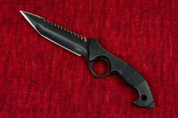 "Ari B'Lilah" professional counterterrorism knife, obverse side. Classic lines, deep and tight radius hollow grinds, aggressive serrations and a well-formed handle shape dominate this knife design