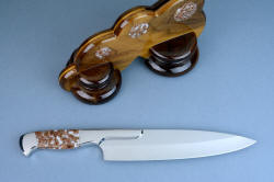 "Concordia"  chef's knife, reverse side knife view. Long, polished and accurate hollow grind offers a superior cutting edge and a thick spine offers strength.