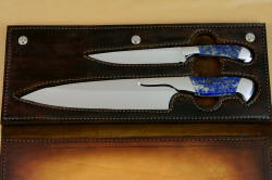 Inside case view with knives Concordia and Sanchez Custom Chef's Knives in T3 cryogenically treated 440C high chromium stainless steel blades, 304 stainless steel bolsters, Lapis Lazuli gemstone handles, book case in top grain leather, leather shoulder and belly, hand-carved, stainless steel snaps