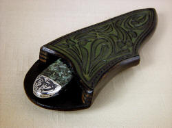 "Deneb" sheath mouth view. Sheath is thick and deep, protecting the wearer and the knife, offering display while echoing patterns of engraving and gemstone in carving