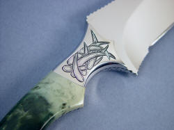 "Desert Wind" Persian dagger, reverse side front bolster detail. Hand-engraved bolsters are 304 high nickel, high chromium stainless steel