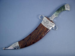 "Desert Wind" in hardwood sheath with stainless steel chape pieces.