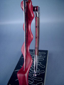 "Desert Wind" stand detail.  Purpleheart hardwood in both stand and sheath welt matching.