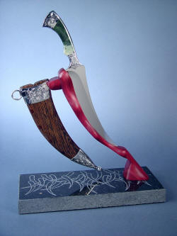 "Desert Wind" side view on stand. Note graceful lines, matching at the sheath angle and blade angle. 