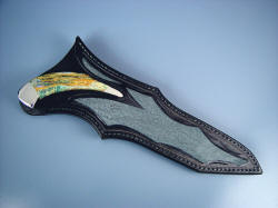 "Dorado" sheathed view. Note lines of sheath compliment knife handle, displaying, inviting handle.