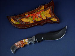 "Flamesteed" reverse side view. Sheath is fully hand-carved and hand-dyed, even on belt loop, which is double row stitched for strength