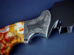 "Flamesteed" reverse side front bolster engraving detail. Pattern frames deep relief area with interlocking leaves matching sheath tooling