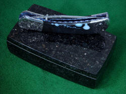"Gemini" Another photo showing the high polish of the Black Galaxy Granite case for the folding knife. This is an everlasting stone, a stone of monuments and permanence.