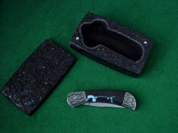 "Gemini" folding knife with Granite case lined with black suede leather for permanent, everlasting storage and display