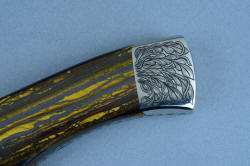 "Golden Eagle" obverse side rear bolster detail, 3 power enlargement. The linear design is carried from the gemstone handle scales to the bolsters