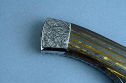 "Golden Eagle" custom knife, reverse side rear bolster engraving. Note fit and finish of handle scales and bolster in stainless steel and gemstone