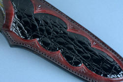 "Golden Eagle" fine handmade knife sheath, front detail. Gentle tone of leather changes from deep rust red to dark metallic, matching gemstone of knife handle