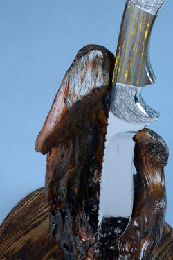 "Golden Eagle" detail of knife in stand view. Many positions are available withthis natural aged stand.